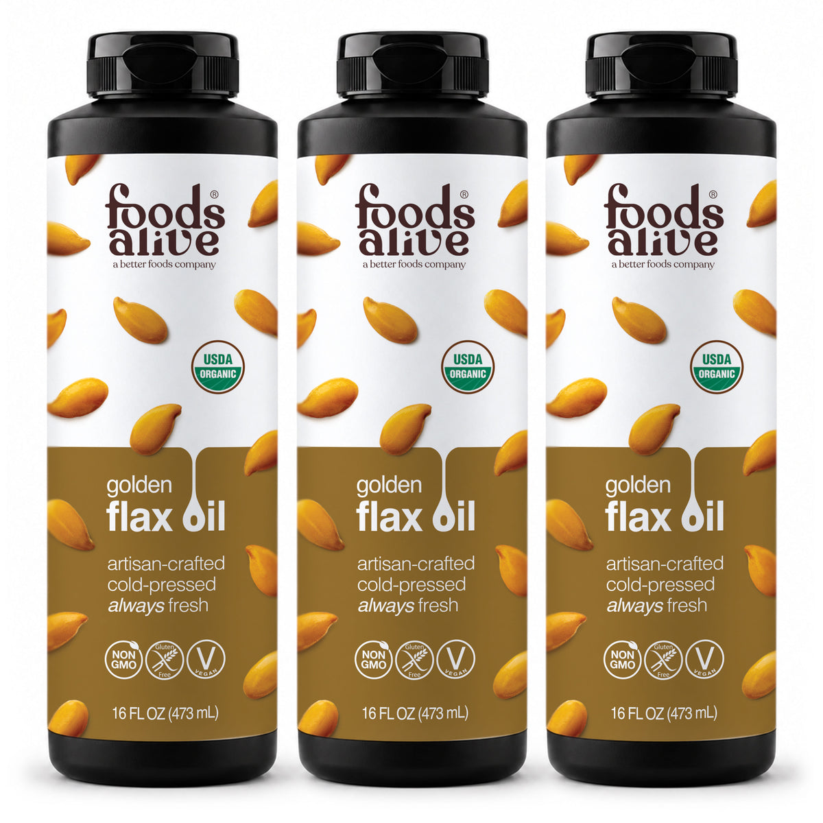 Foods Alive Organic Cold-Pressed Golden Flax Oil 16 oz 3-pack, three black plastic bottles with black caps and gold labels featuring golden flaxseeds. 