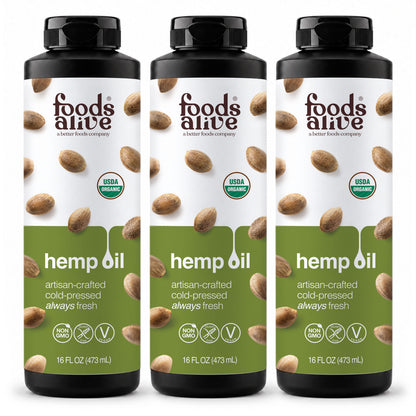 Foods Alive Organic Cold-Pressed Hemp Seed Oil 16 oz 3-pack featuring three black plastic bottles with green and white hemp seed labels. 